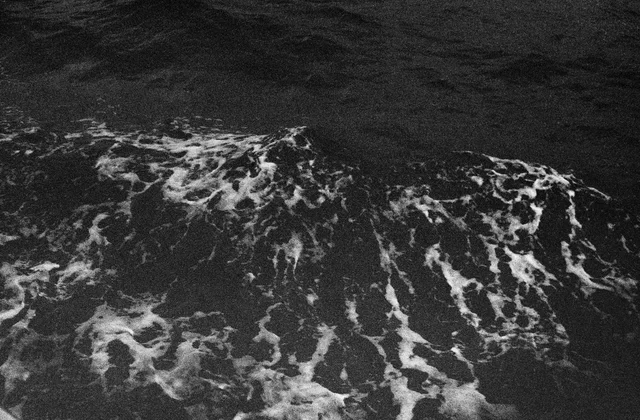 White foam swirling across dark moving water